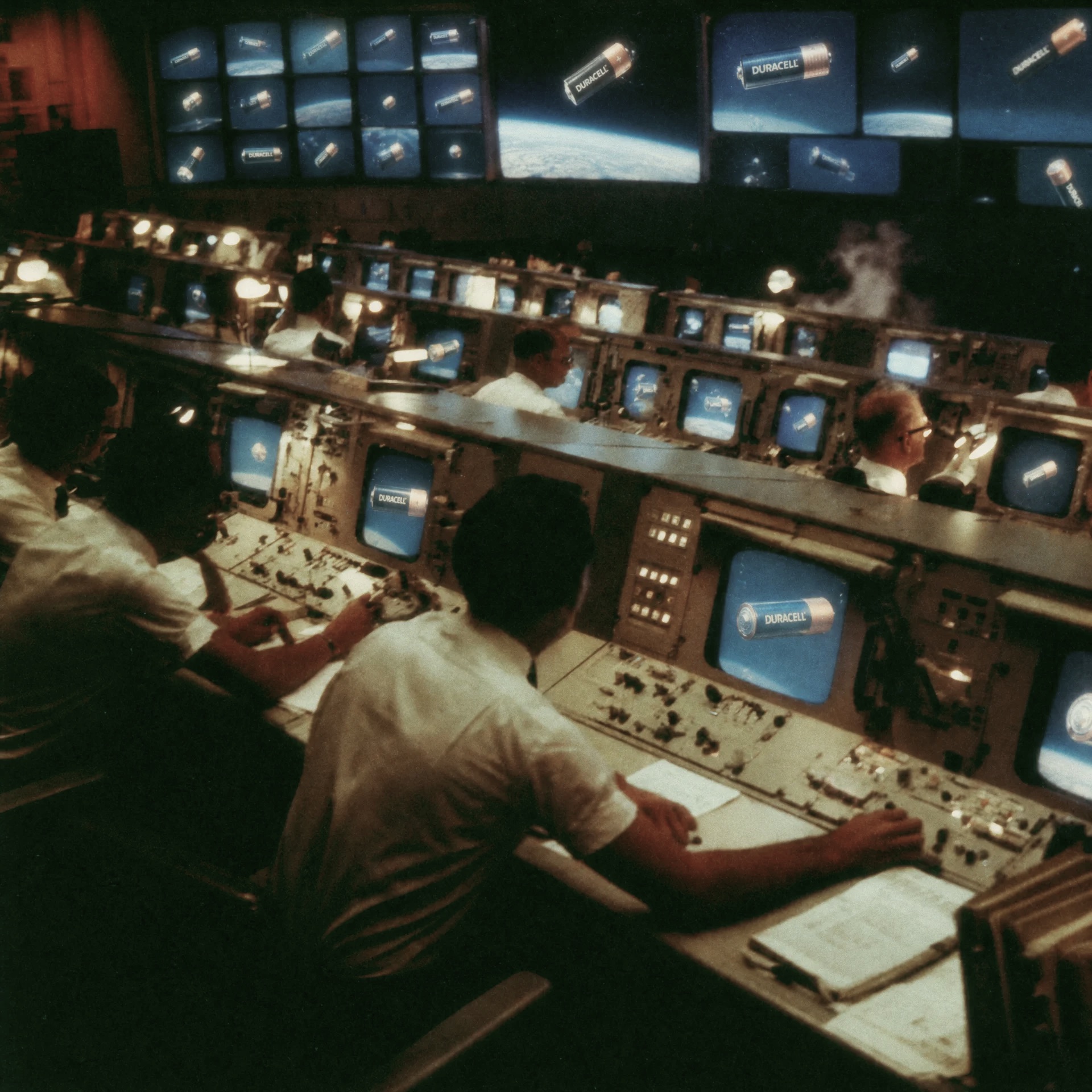 A 1960s mission control room, Duracell batteries floating on every screen