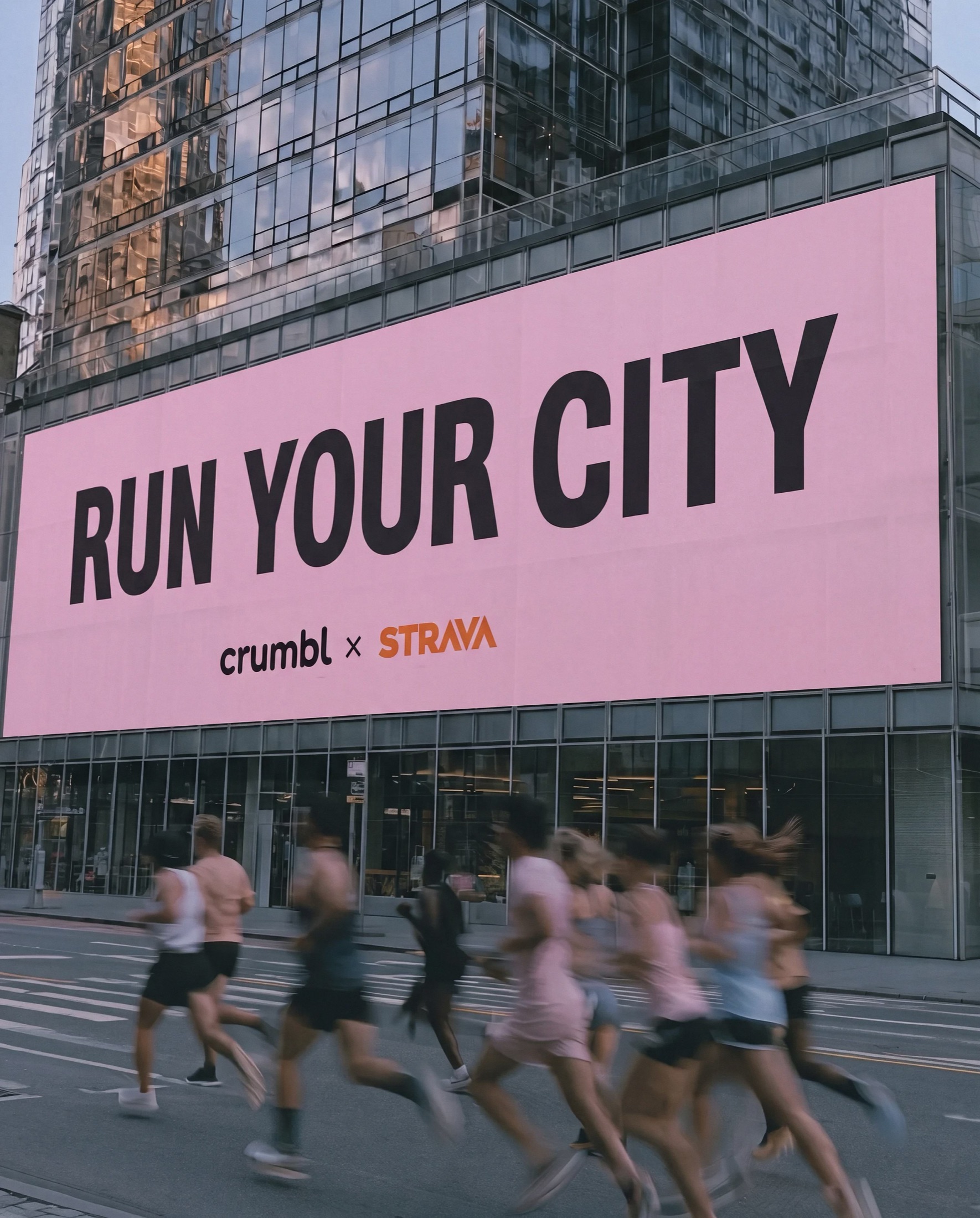 A pink Run Your City billboard above runners on a city street